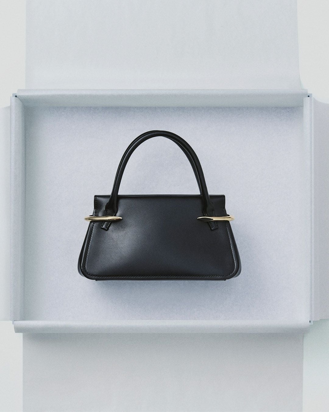 Mini Pinch bag in leather