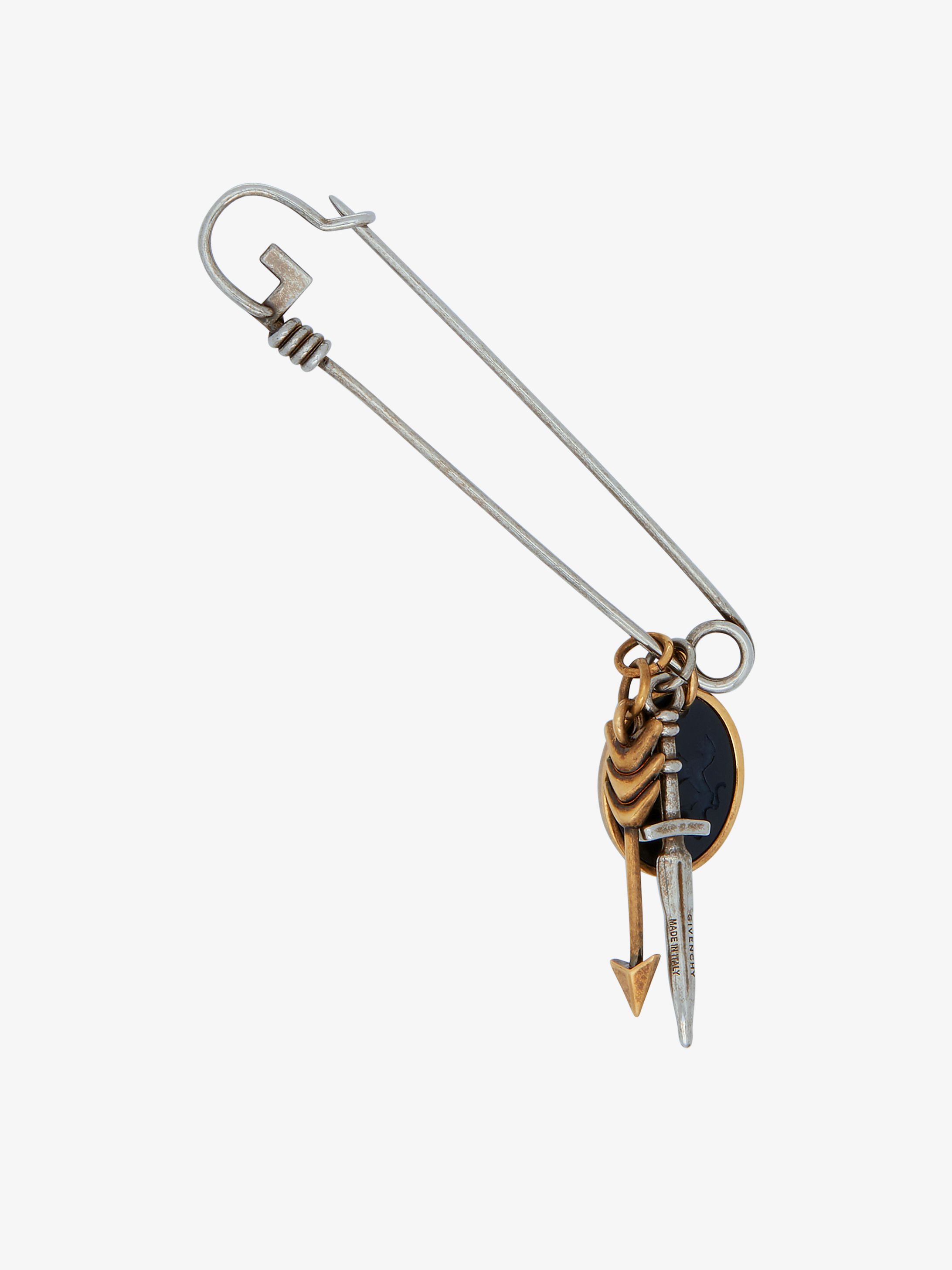 G pin brooch