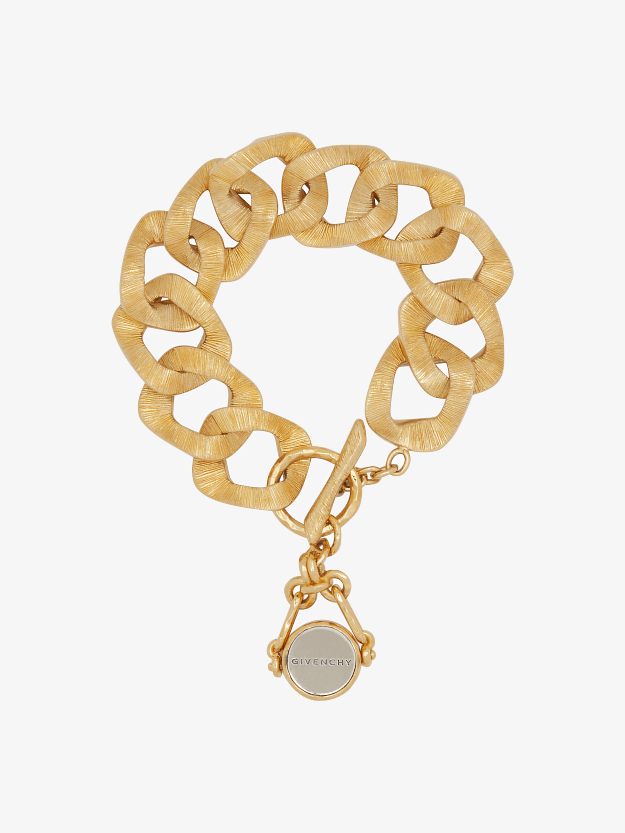 Double face bracelet with twisted charm