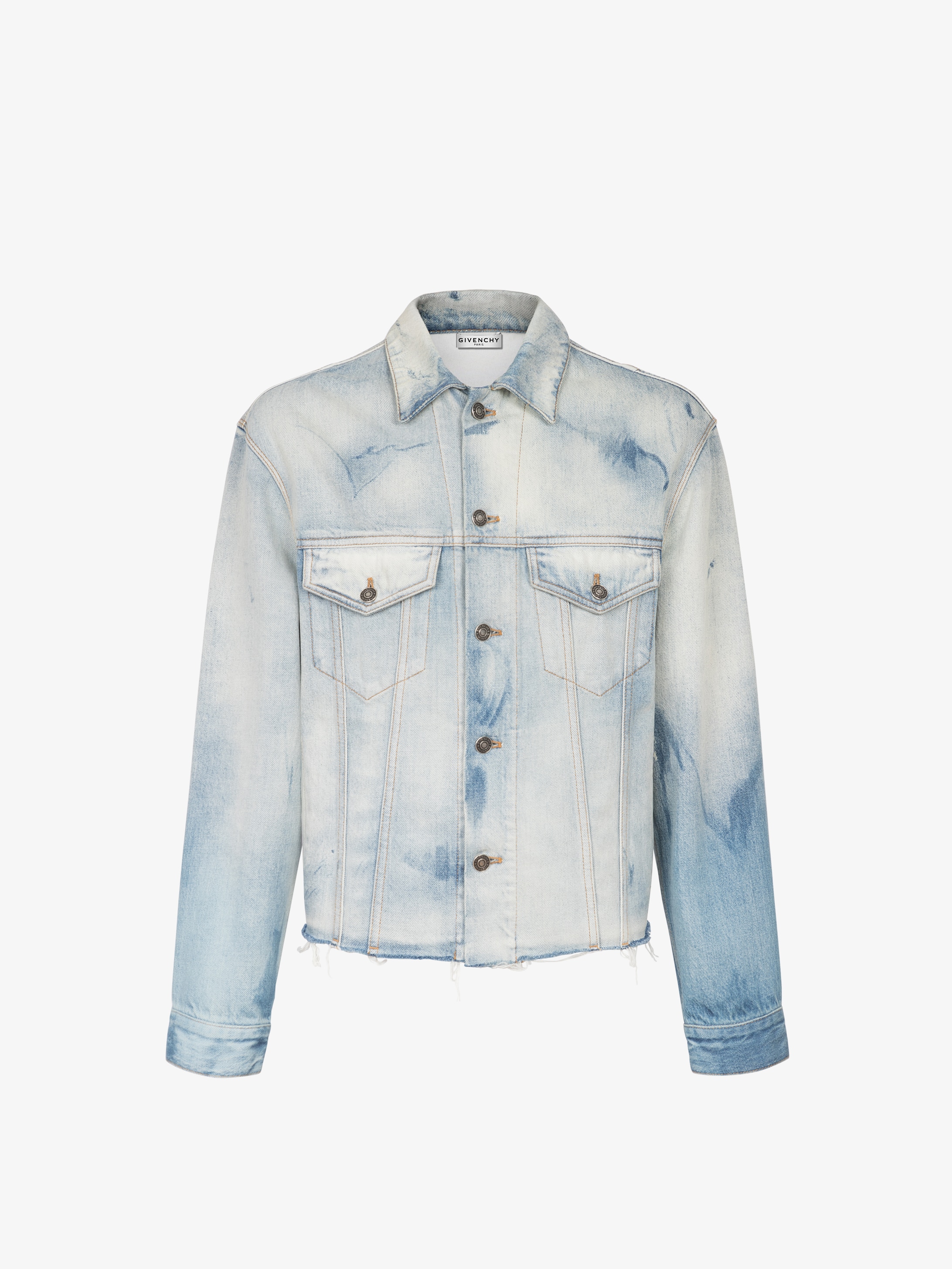 Jacket in washed-out denim with raw cuts